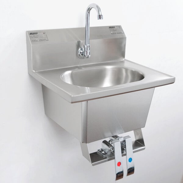 A stainless steel Eagle Group wall mount hand sink with gooseneck faucet and knee pedals.