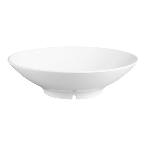 A white round melamine vegetable bowl with a 1.4 quart capacity.