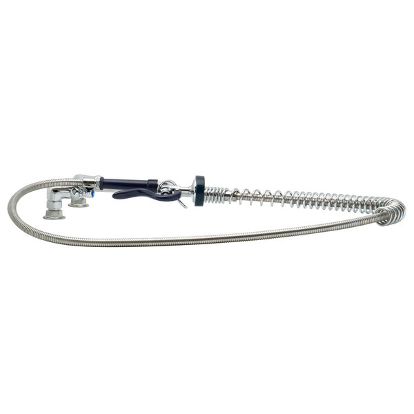 A T&S wall mount pet grooming faucet with metal hose and nozzle.