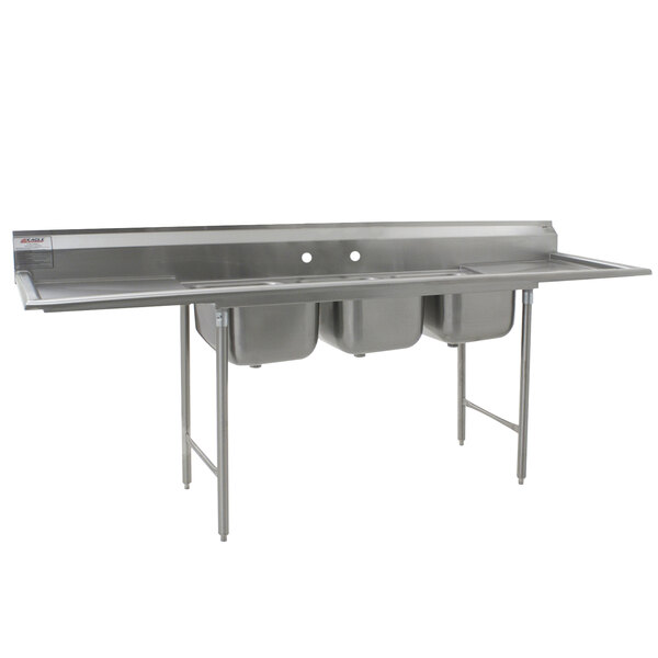 A stainless steel Eagle Group three compartment sink with two drainboards.