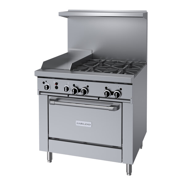 A stainless steel Garland commercial gas range with four burners, a griddle, and an oven.