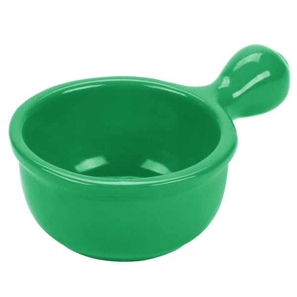 A green Tablecraft metal bowl with a handle.