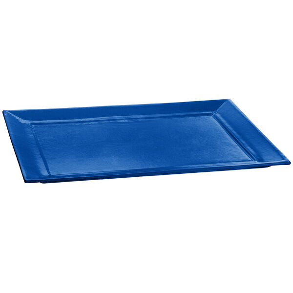 A cobalt blue rectangular cast aluminum platter with a rectangle shape.