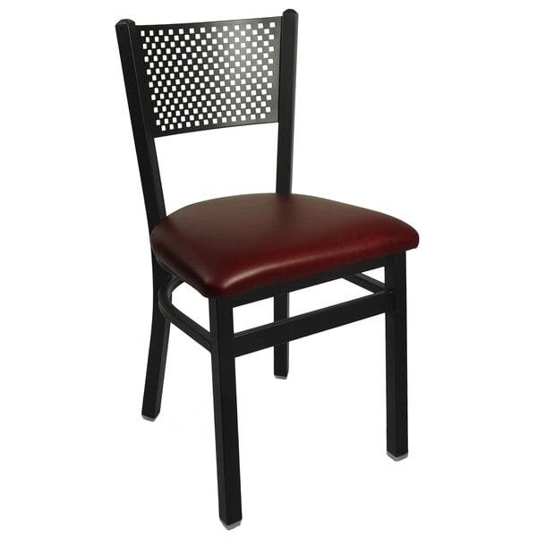 A BFM Seating black steel side chair with burgundy vinyl seat.