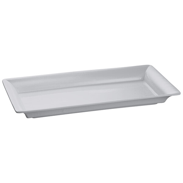 A natural rectangular cast aluminum platter with a handle.