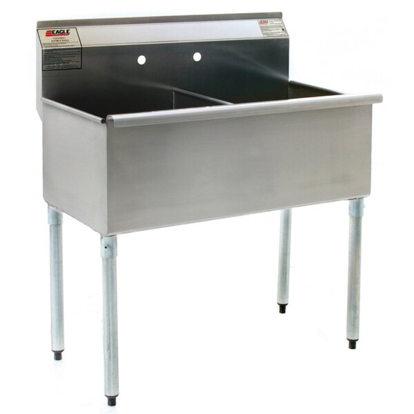 A Eagle Group stainless steel utility sink with legs.