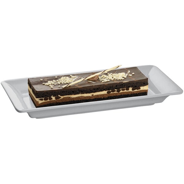 A rectangular chocolate cake on a Tablecraft cast aluminum platter.