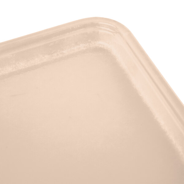 A light peach rectangular Cambro fiberglass tray with a black border.