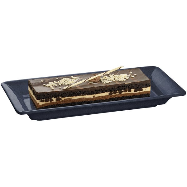 A rectangular chocolate cake on a Tablecraft Midnight with Blue Speckle cast aluminum platter.