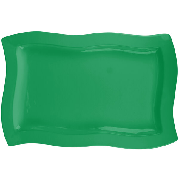 A green rectangular Tablecraft platter with wavy edges.
