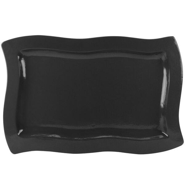A black rectangular Tablecraft platter with wavy edges.