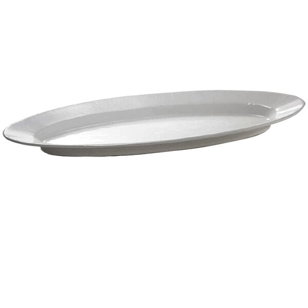 A natural cast aluminum oval platter with a white background.