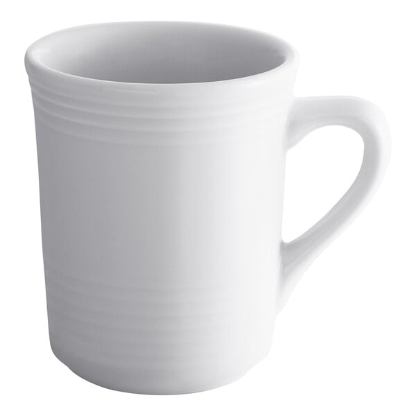 A Tuxton white china mug with a handle.