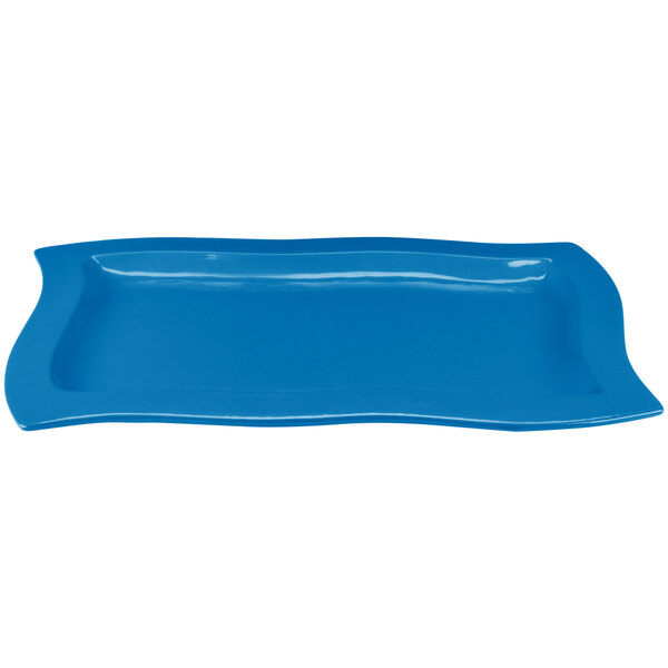 A sky blue rectangular cast aluminum serving platter with a wavy design.
