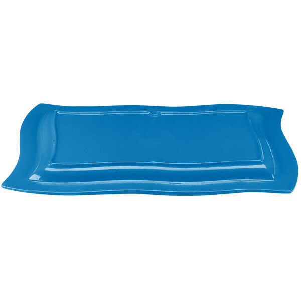 A sky blue rectangular platter with a wavy edge.