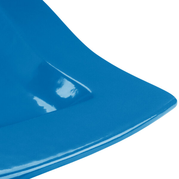 A blue and white rectangular platter with a curved edge.