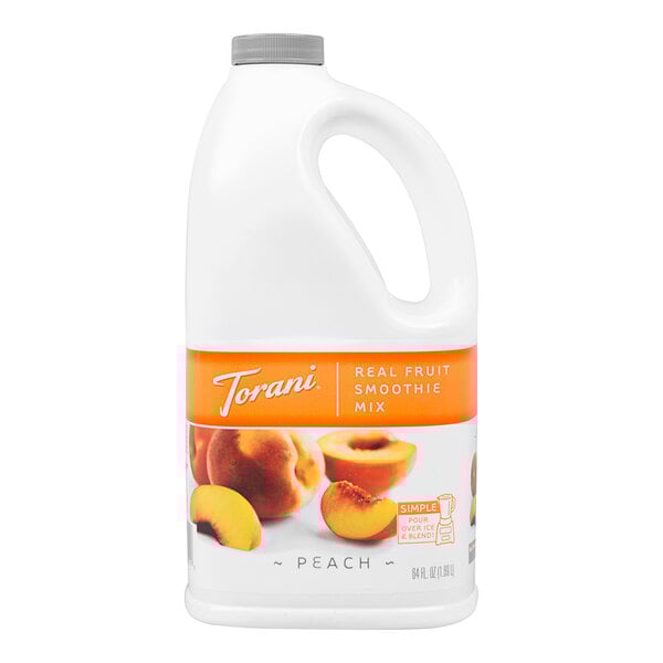 A white jug of Torani Peach Fruit Smoothie Mix with a yellow and peach fruit label.