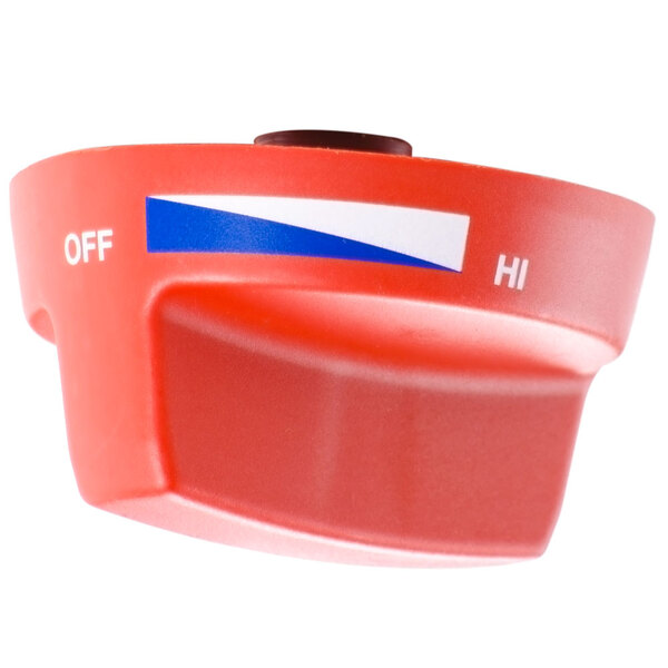 A red plastic Tri-Star knob with a white and blue label.