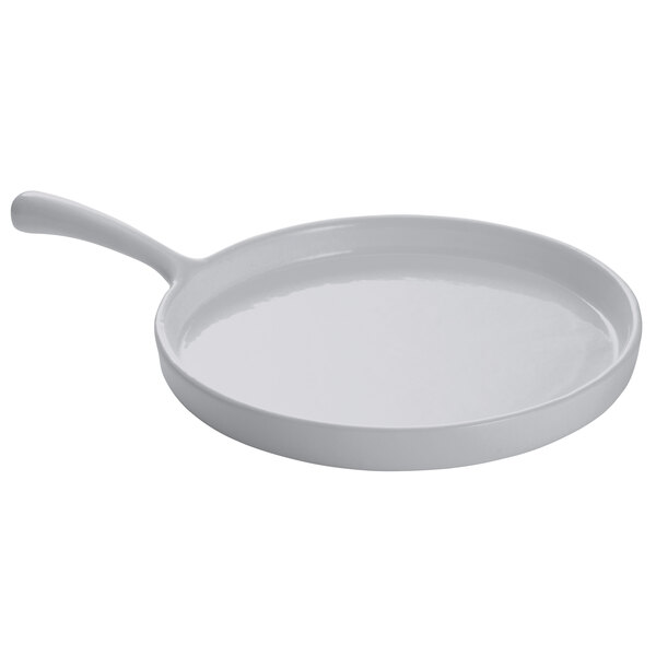 A white pan with a curved edge and a black handle.