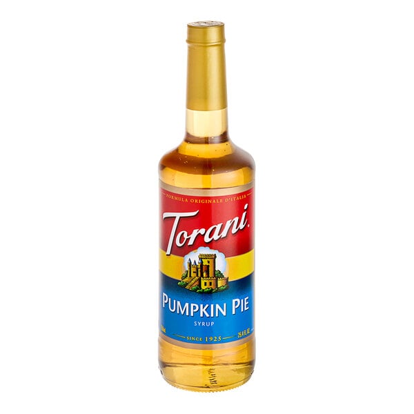 A Torani Pumpkin Pie flavoring syrup in a glass bottle with a red label.