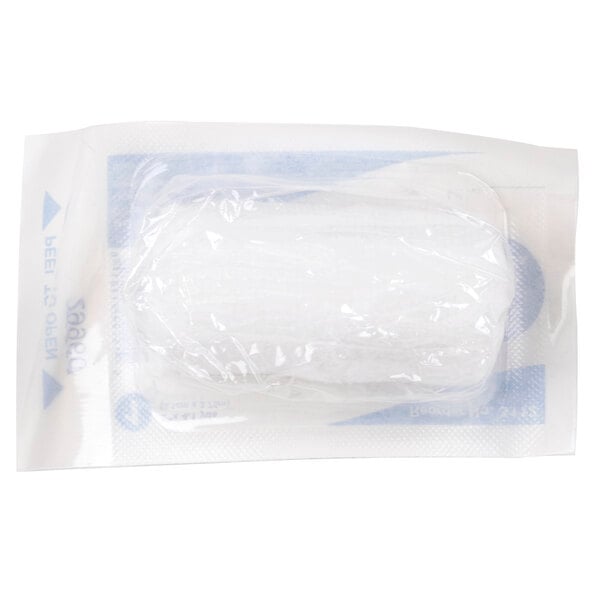 A close-up of a white plastic bag containing Medique conforming gauze roll.