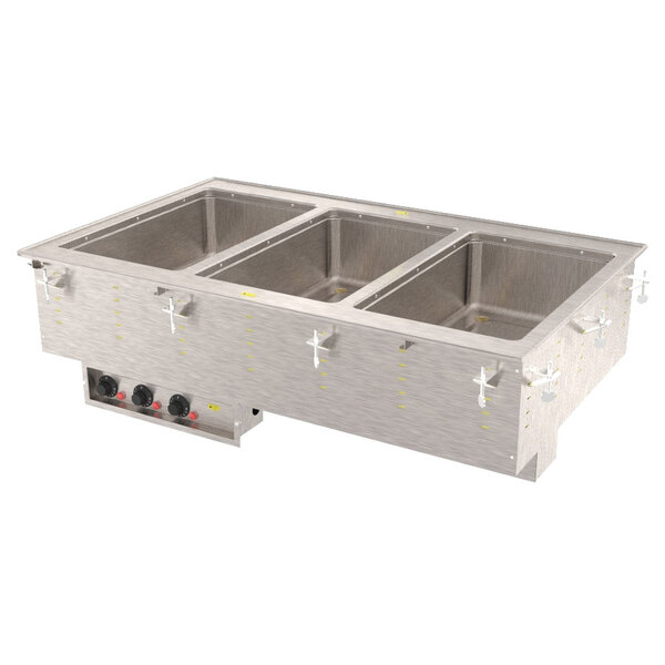 A Vollrath drop-in hot food well with three compartments on a counter.