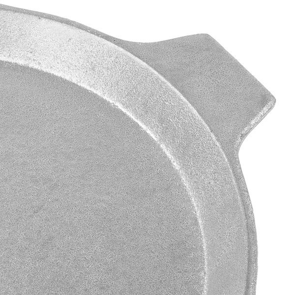 A Tablecraft gray cast aluminum pizza tray with a handle.