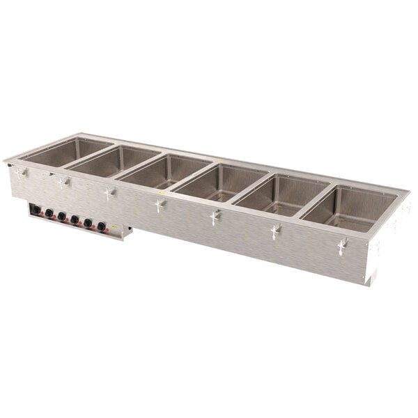 A Vollrath drop-in hot food well with four compartments in a stainless steel counter.