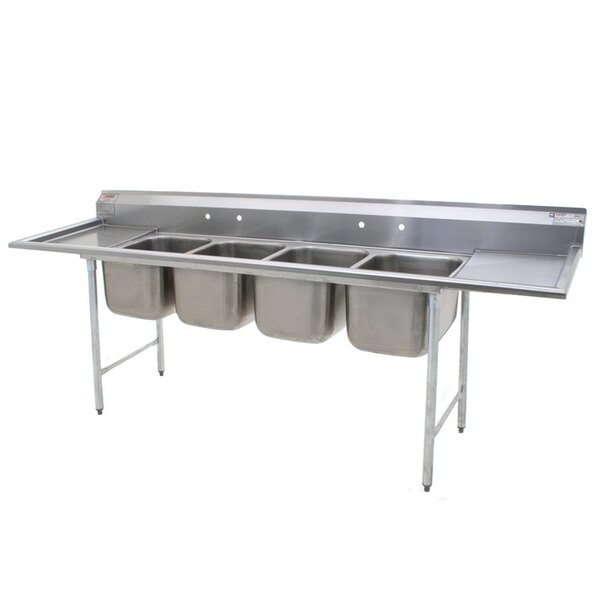 A stainless steel Eagle Group 4 compartment sink with two drainboards.