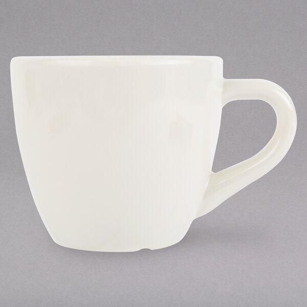 A Diamond ivory melamine espresso cup with a handle.