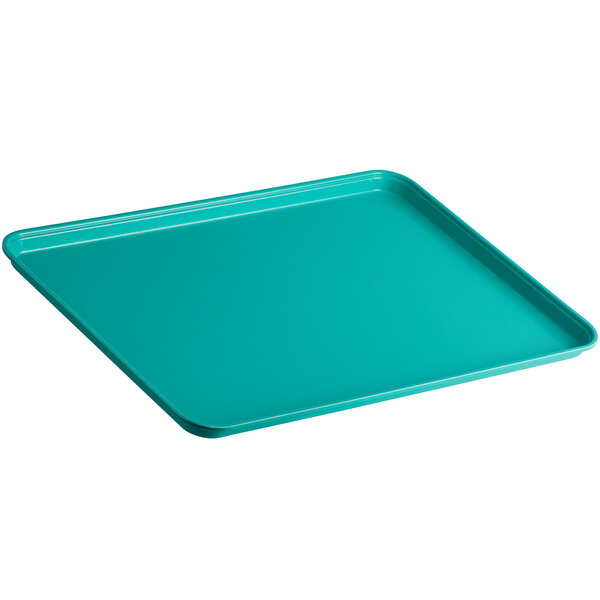 A green Cambro market tray with a plastic handle.