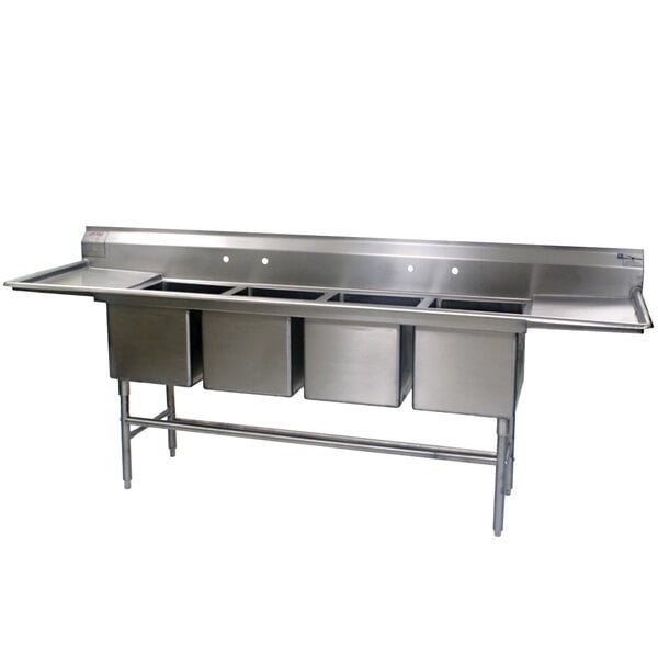 A stainless steel Eagle Group 4 compartment sink with two 24" drainboards.