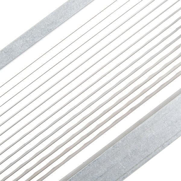 A close-up of a Nemco metal scalloped blade assembly.