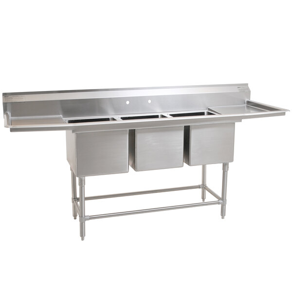 A stainless steel Eagle Group 3 compartment sink with two drainboards.