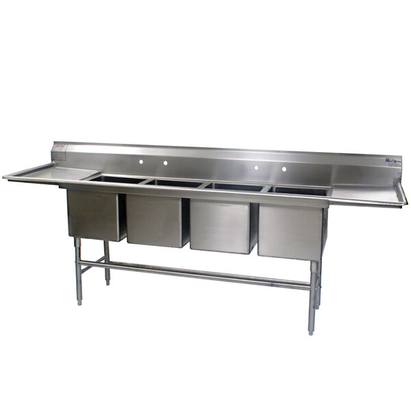 A stainless steel Eagle Group 4 compartment sink with two drainboards.