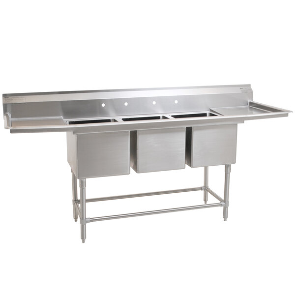 A stainless steel Eagle Group three compartment sink with two drainboards.