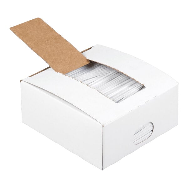 A white cardboard box with a perforated opening revealing a stack of white twist ties inside.