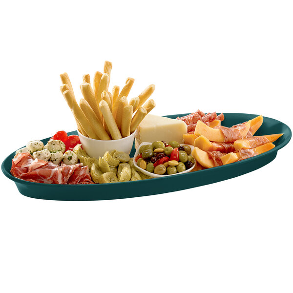 A Tablecraft hunter green cast aluminum king fish platter with a variety of food on it, including cheese and olives.