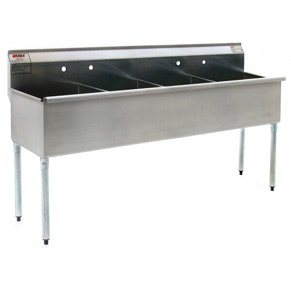 A stainless steel Eagle Group utility sink with four compartments.