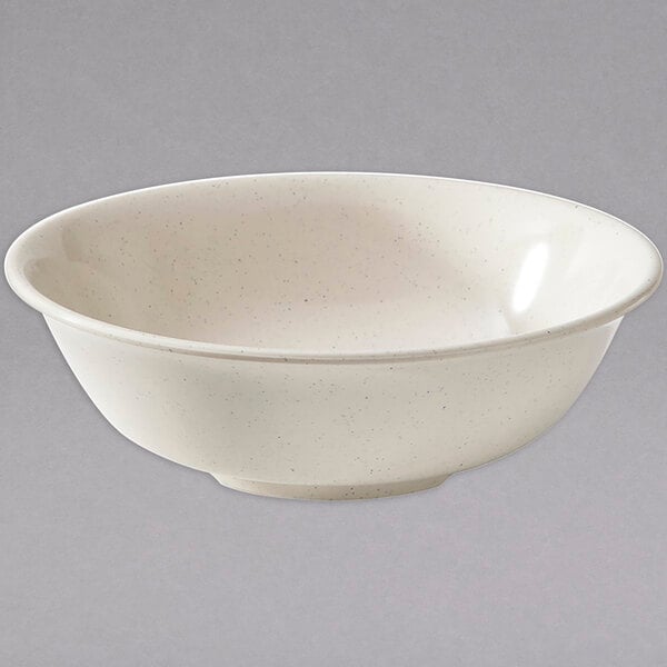 A white bowl with a speckled rim.