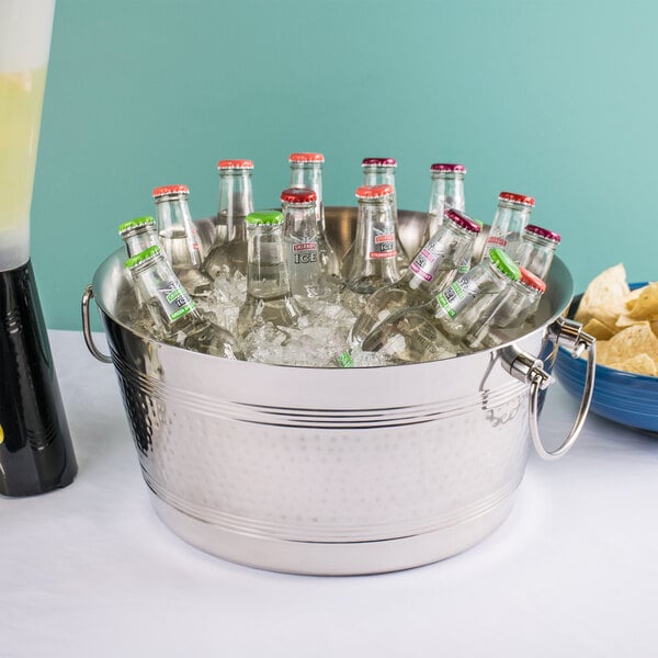 An American Metalcraft double wall party tub filled with bottles of beer on a table.