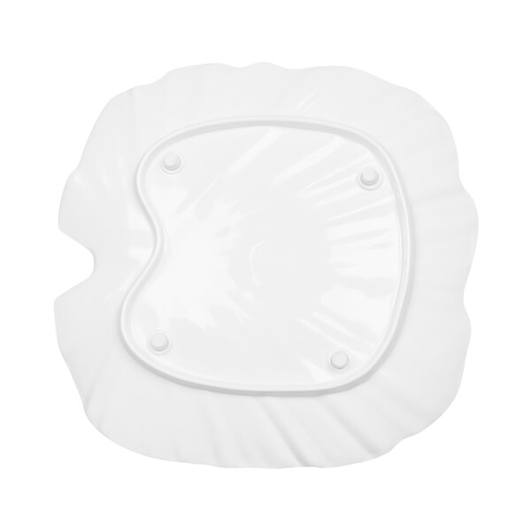 A white melamine platter with a palm leaf design on the curved surface.