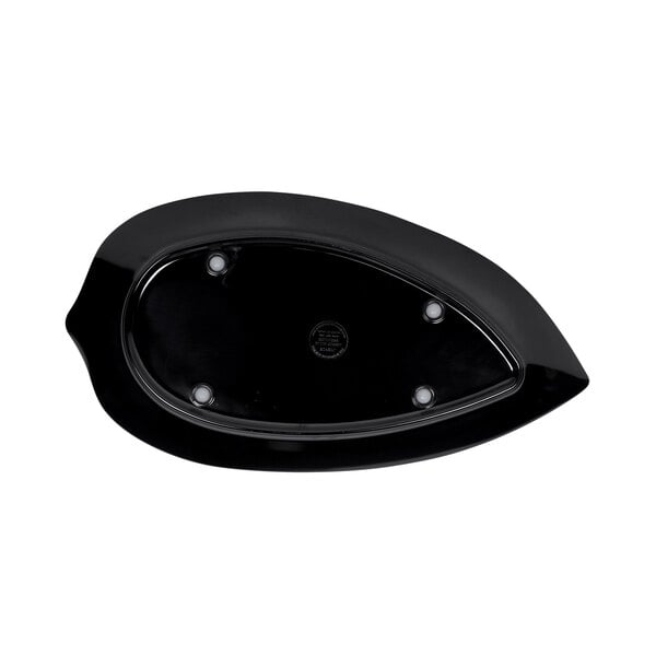 A black oval platter with leaf design and white dots.