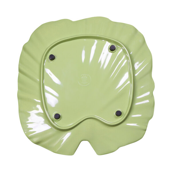 A green melamine platter with a palm leaf design and black accents.