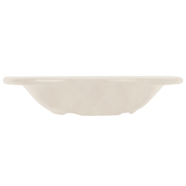 A white bowl with a handle on a white background.