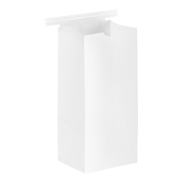 A plain white paper coffee bag with a reclosable tin tie at the top.
