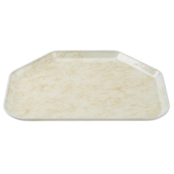 A white tray with a gold trapezoid pattern.