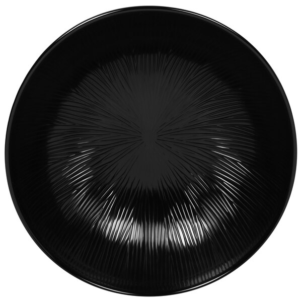 A black bowl with a circular spiral design.