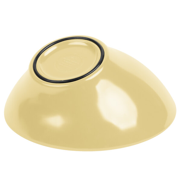 A yellow Elite Global Solutions melamine bowl with a black ring.