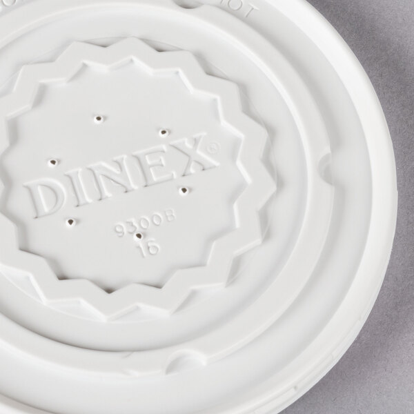 a white plastic lid with text